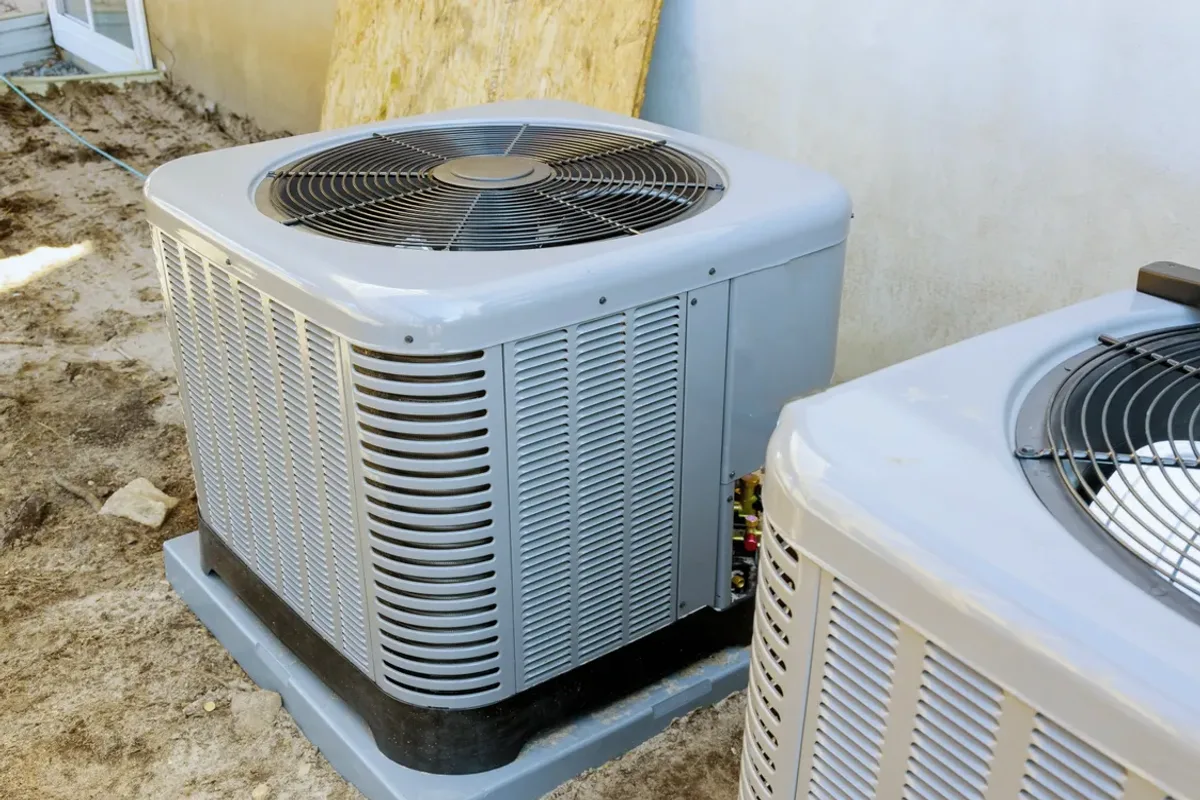 Two outdoor air conditioner condensers